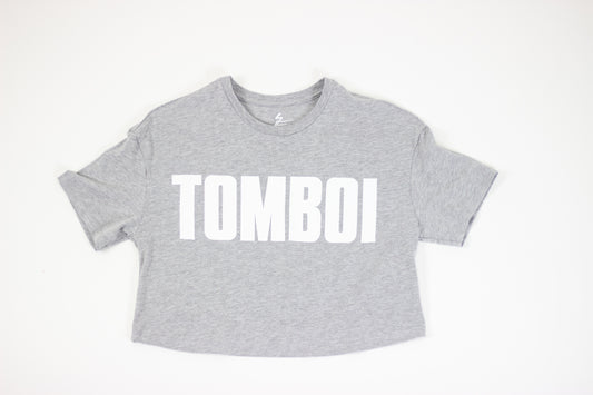 gray TOMBOI crop top with white writing