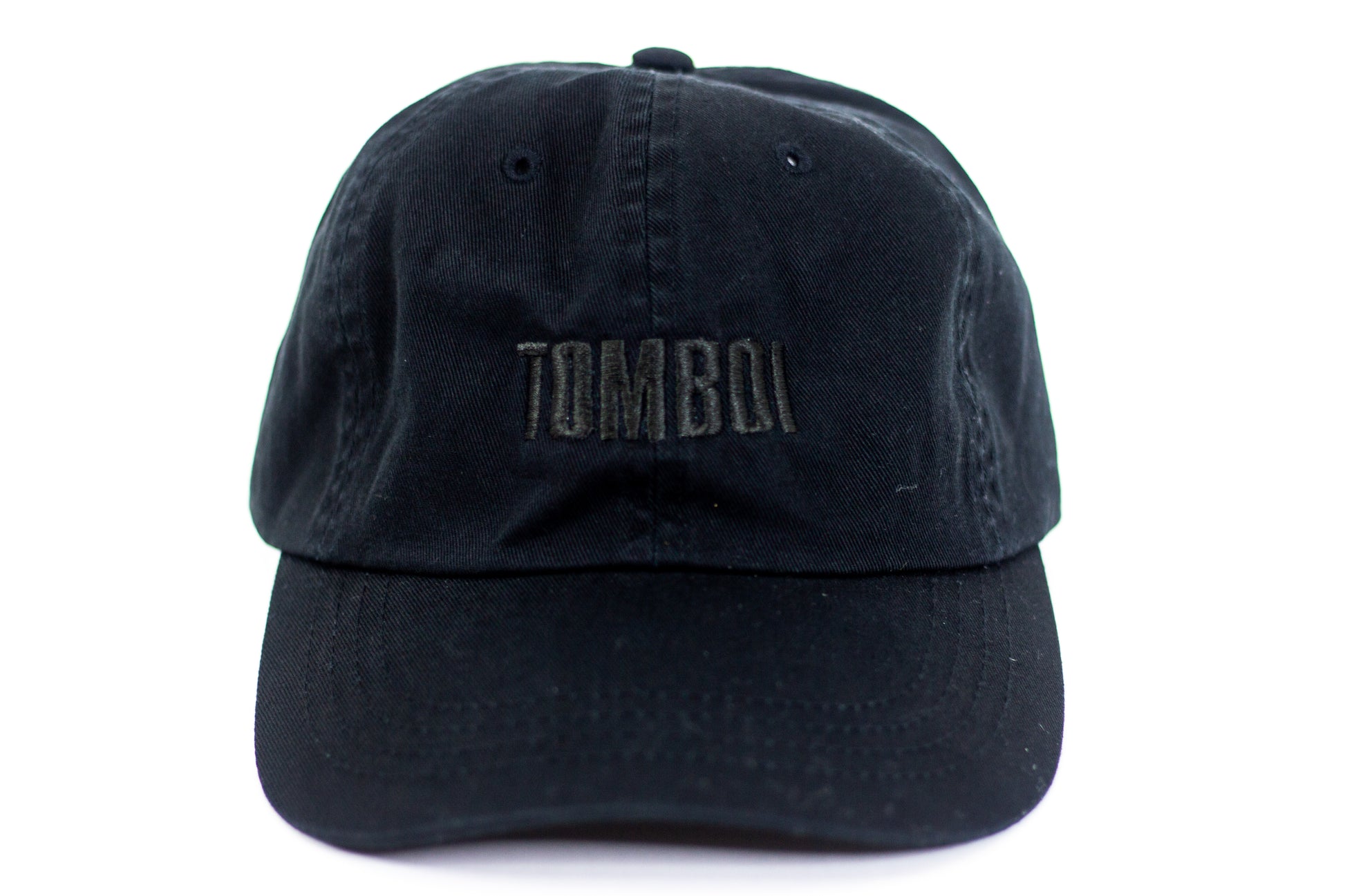 TOMBOI dad hat with black writing